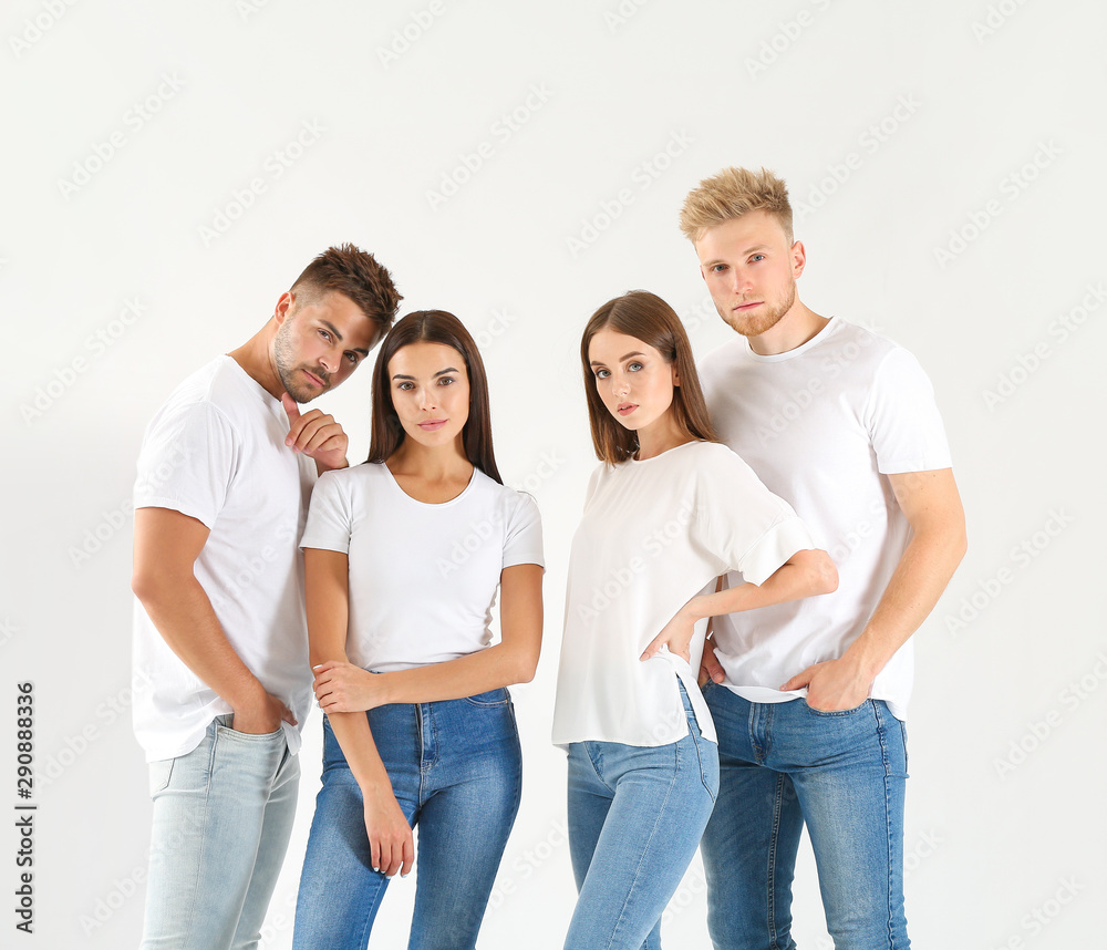 Group of young people in stylish casual clothes on white background