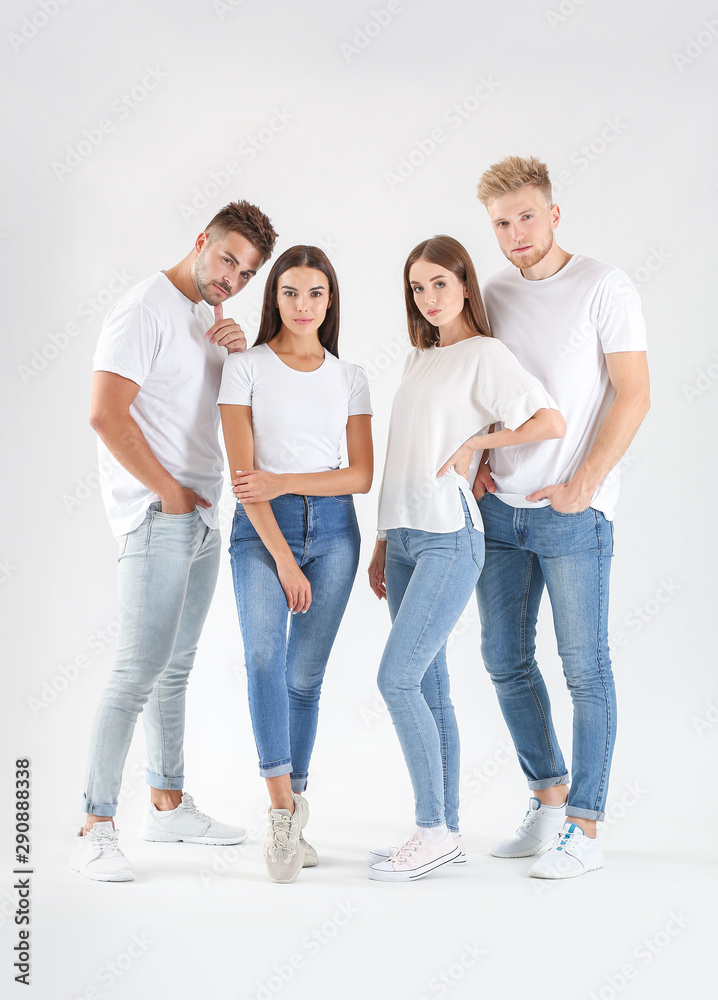 Group of young people in stylish casual clothes on white background