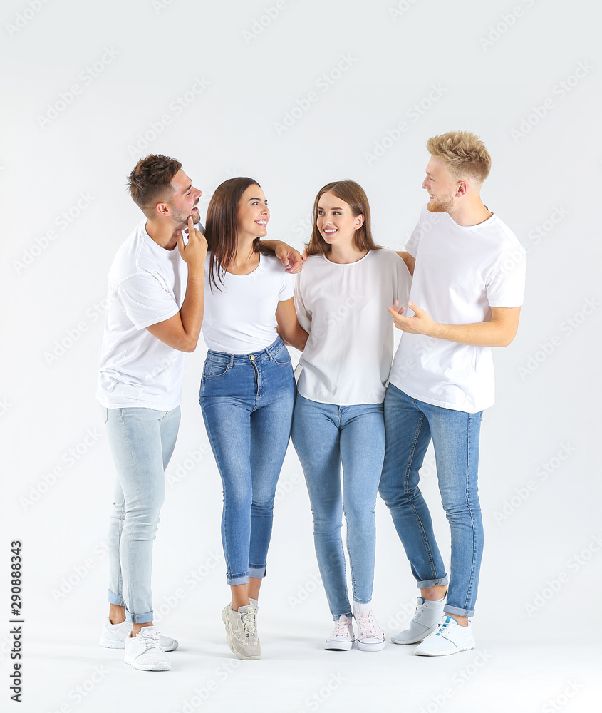 Group of young people in stylish casual clothes on white background