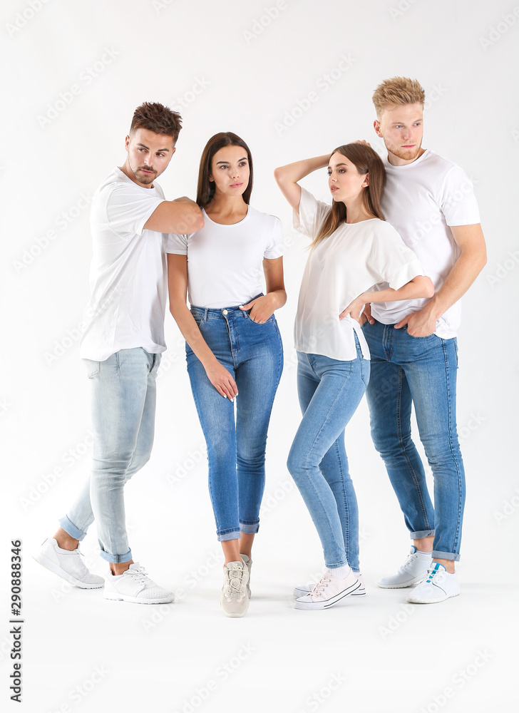 Group of young people in stylish casual clothes on white background