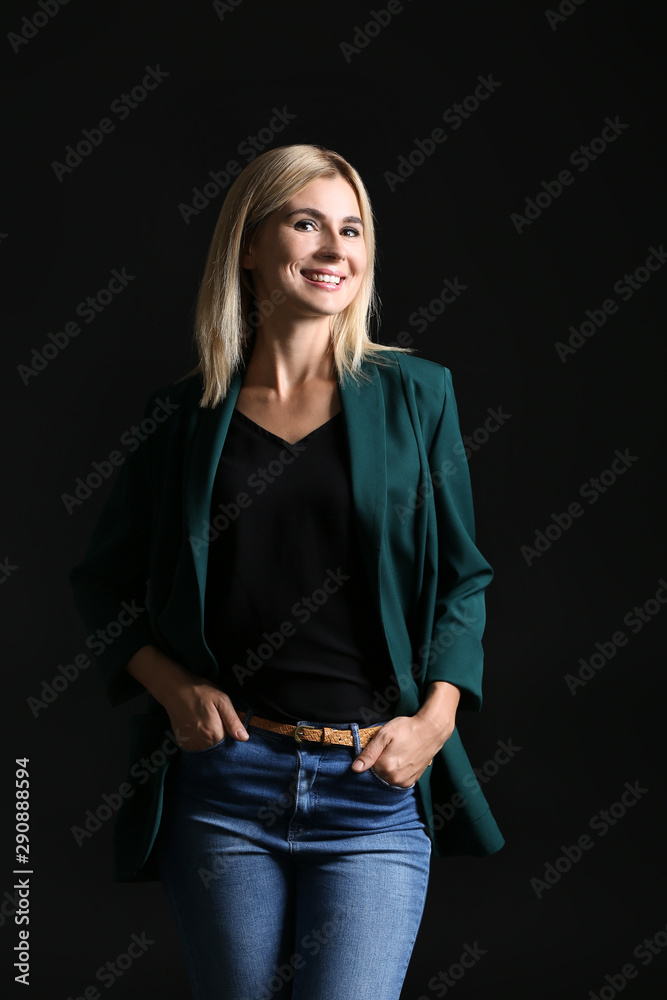 Beautiful stylish businesswoman on dark background