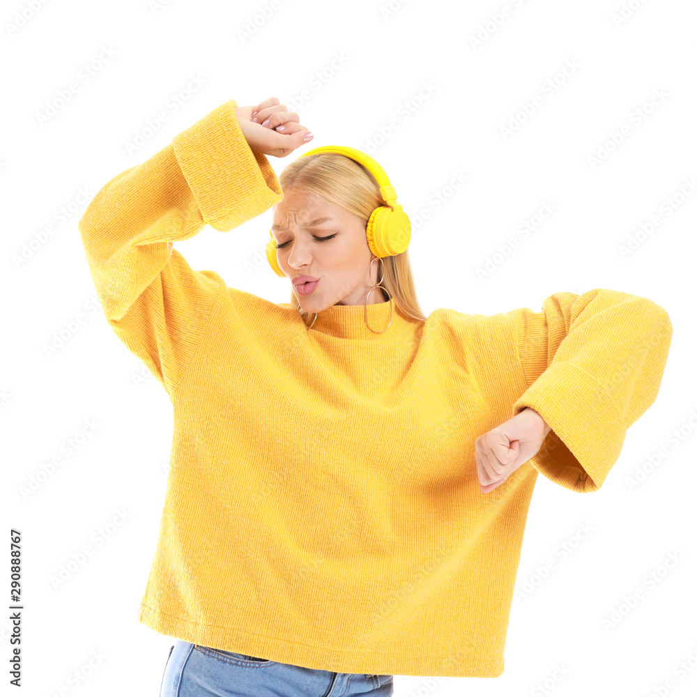 Beautiful young woman listening to music on white background