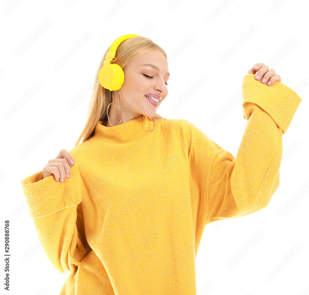 Beautiful young woman listening to music on white background