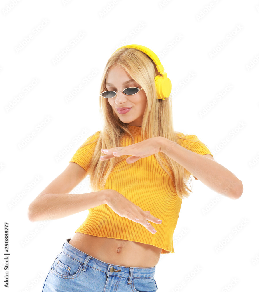 Beautiful young woman listening to music on white background