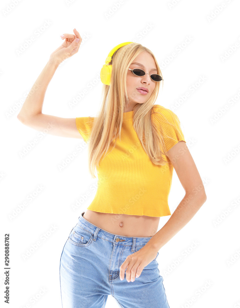 Beautiful young woman listening to music on white background