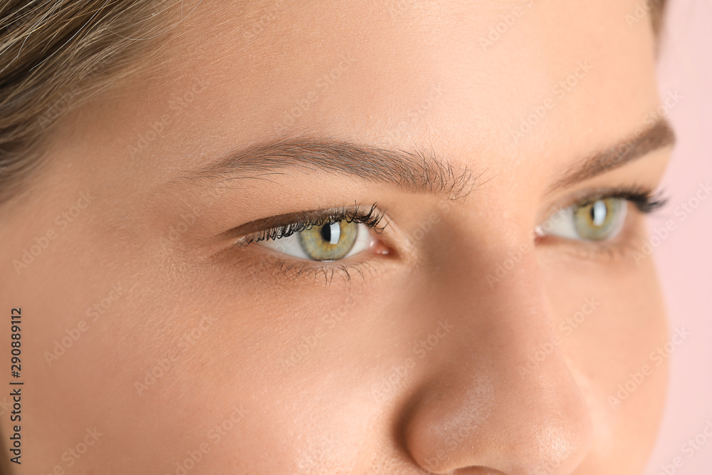 Young woman with beautiful eyebrows, closeup