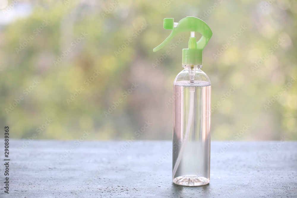 Bottle of air freshener on table