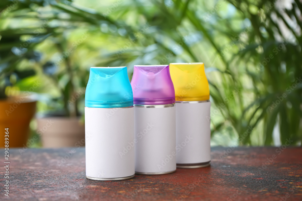 Air fresheners on table against blurred background