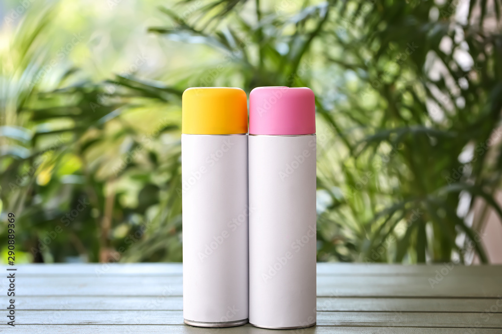 Air fresheners on table against blurred background