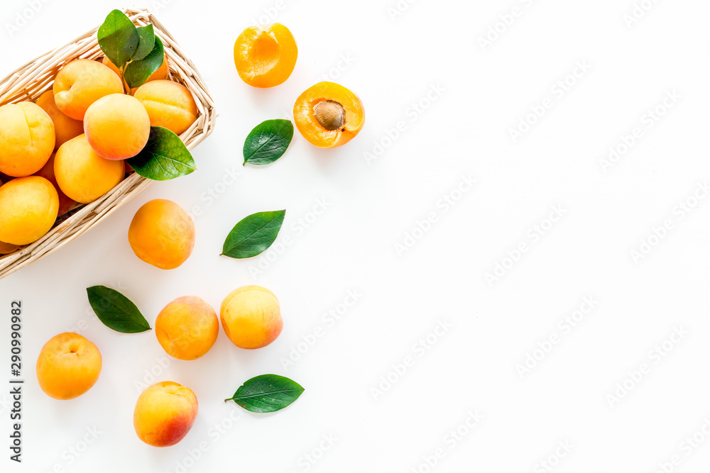 Collect apricots, white background top view copy space, pattern with leaves