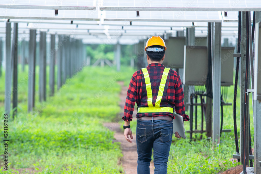 Engineer working on checking solar power plant.