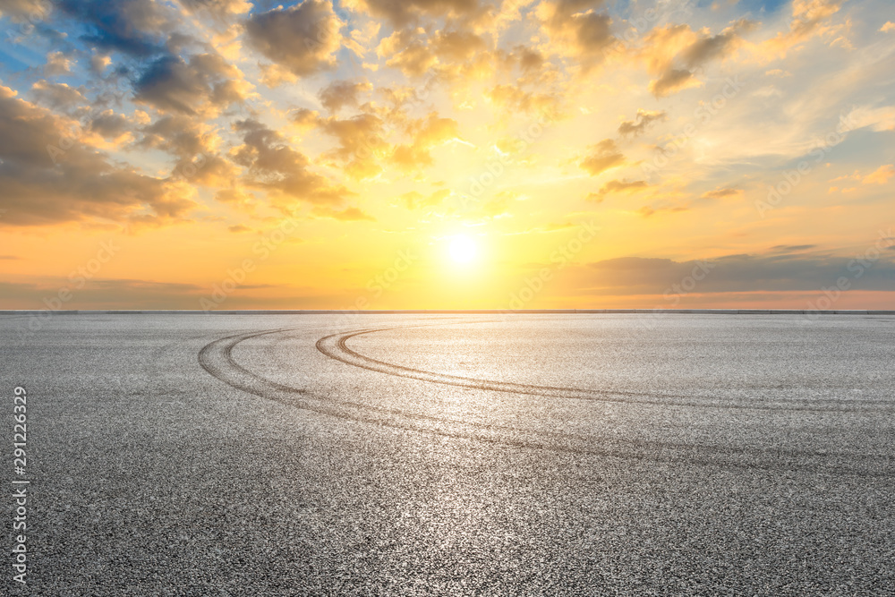 Race track ground and beautiful sunset clouds