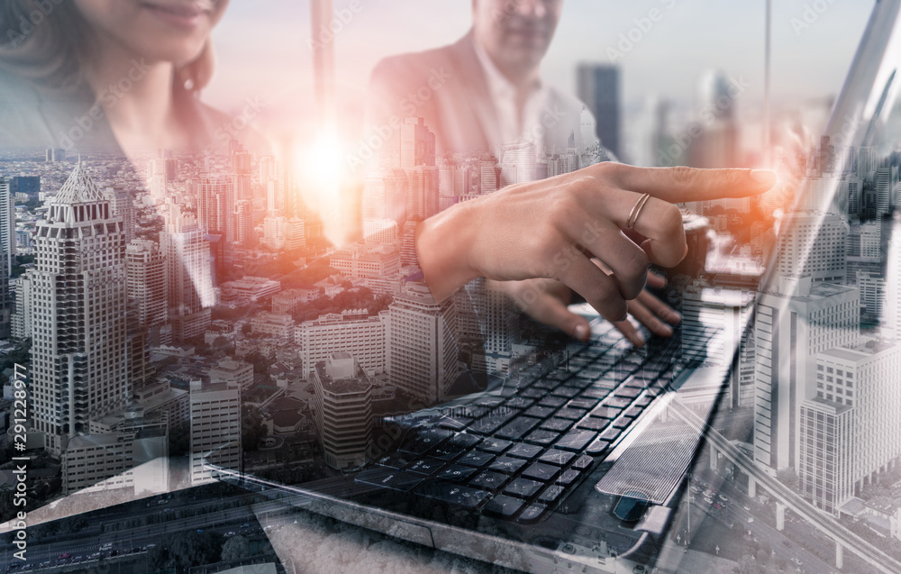 Double exposure image of business people group meeting on city office building in background showing