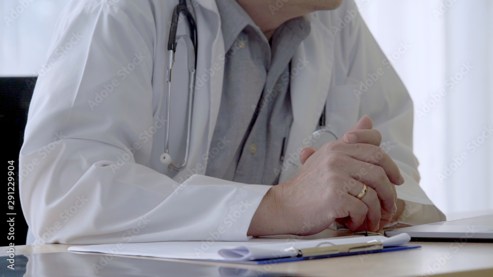 Doctor working with patient health data in the hospital office. Medical service and healthcare conce