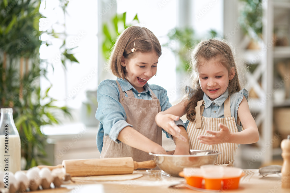 girls are cooking cookies