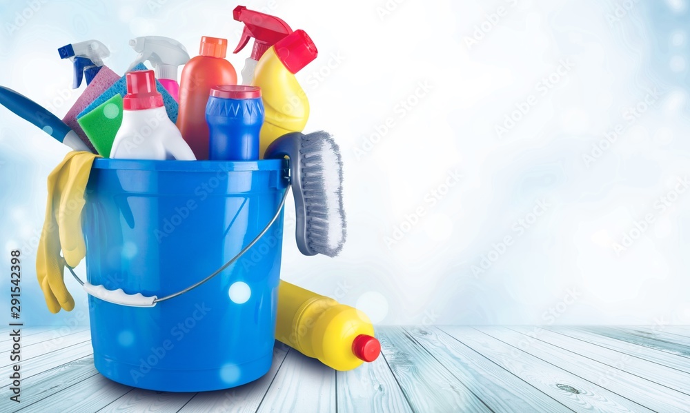 Plastic bottle, cleaning sponge and gloves  on background