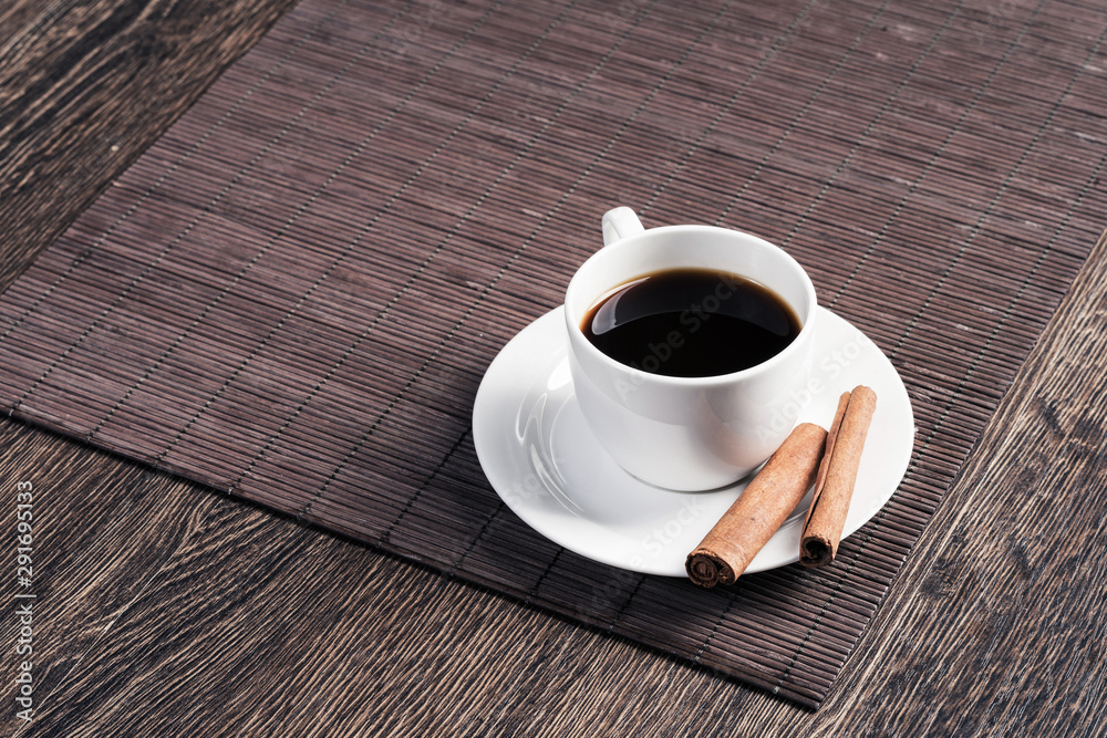 Cup of black coffee on wooden table