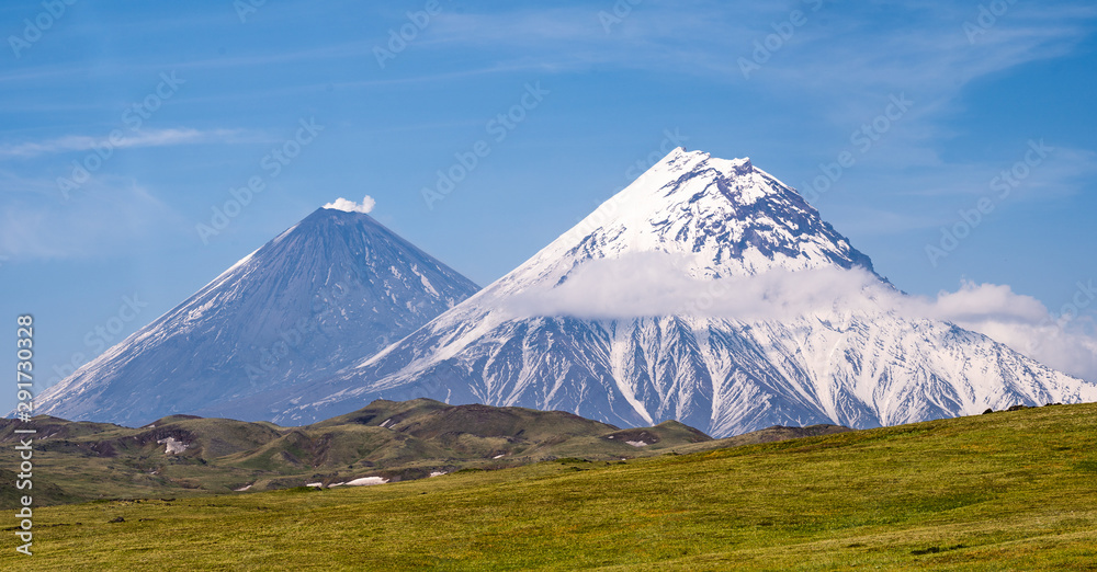 Picturesque summer volcanic landscape of Kamchatka Peninsula: view of active Volcano.