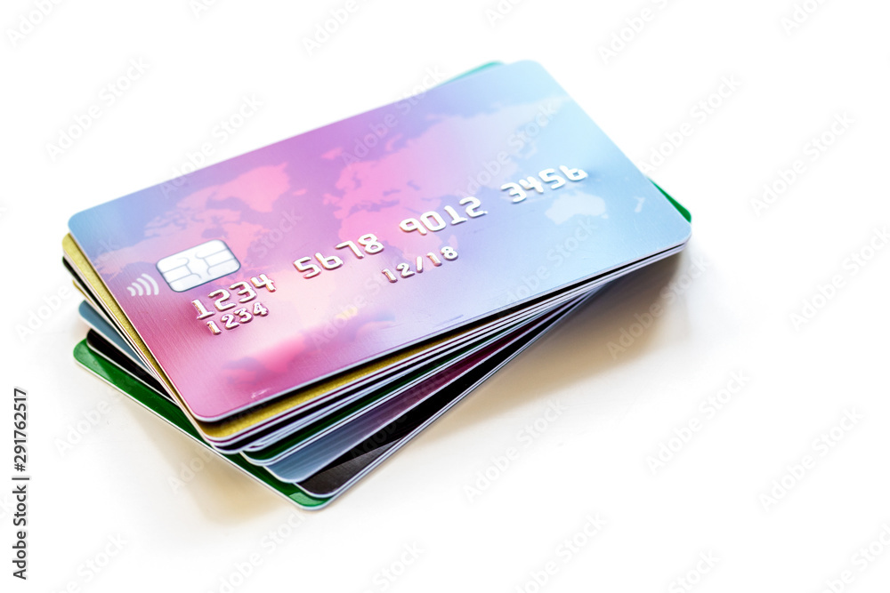 pile of credit cards on white background