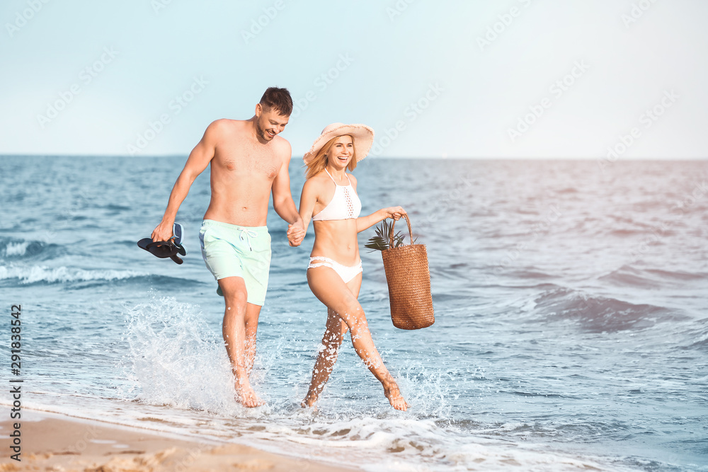 Happy couple spending time at sea resort