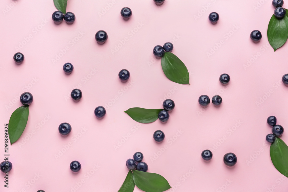 Fresh acai berries on color background