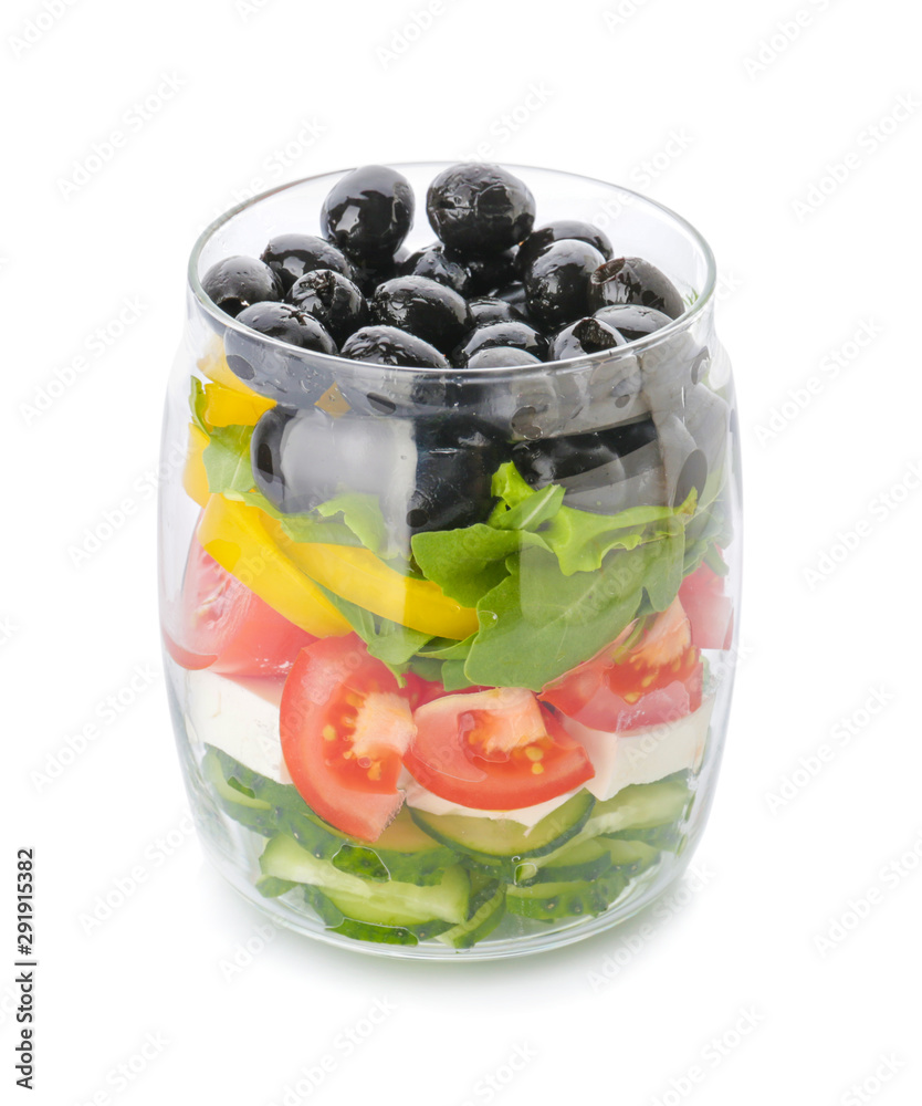 Glass with tasty Greek salad on white background