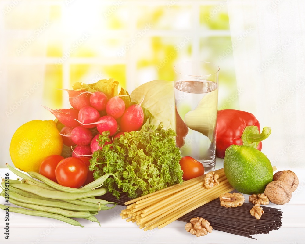 Fresh tasty vegetables with water on background