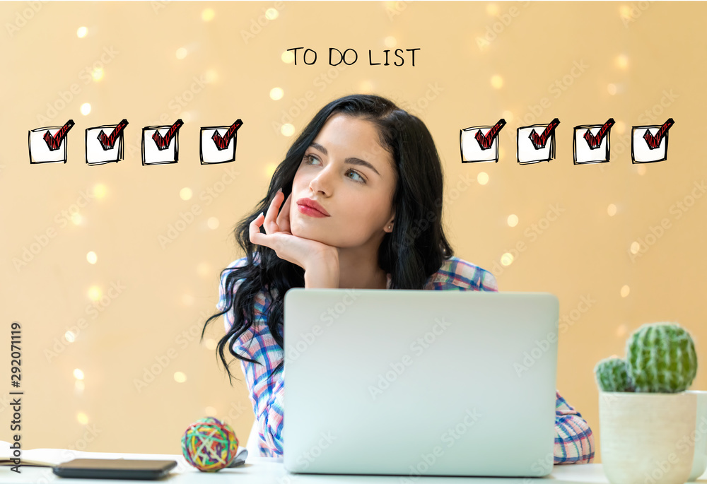 To do list with young woman using a laptop