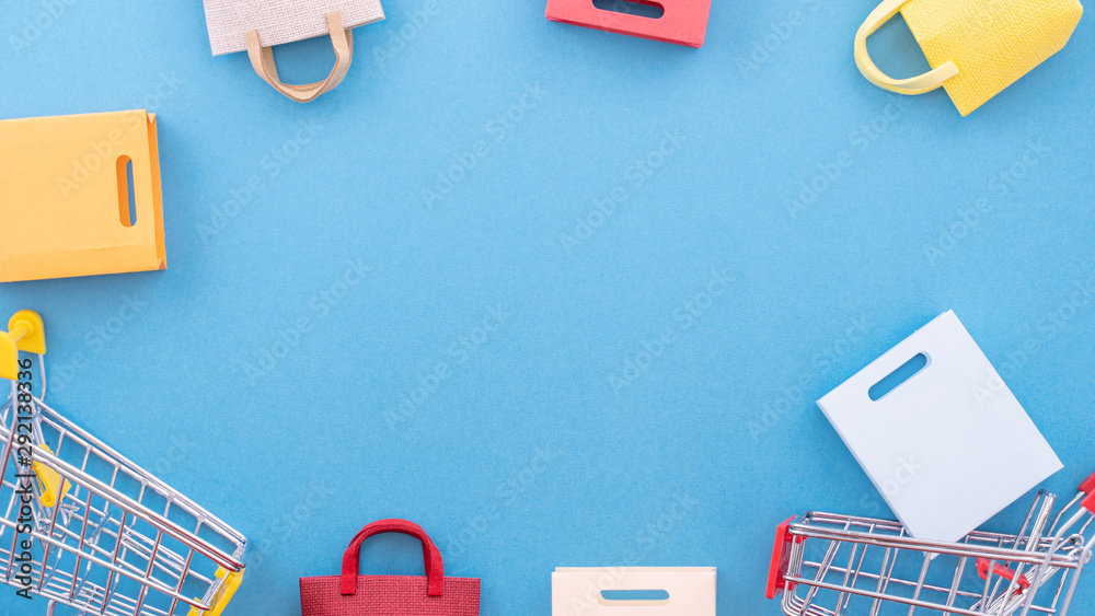 Abstract design element, concept of annual sale, shopping season - mini yellow cart with paper bag i