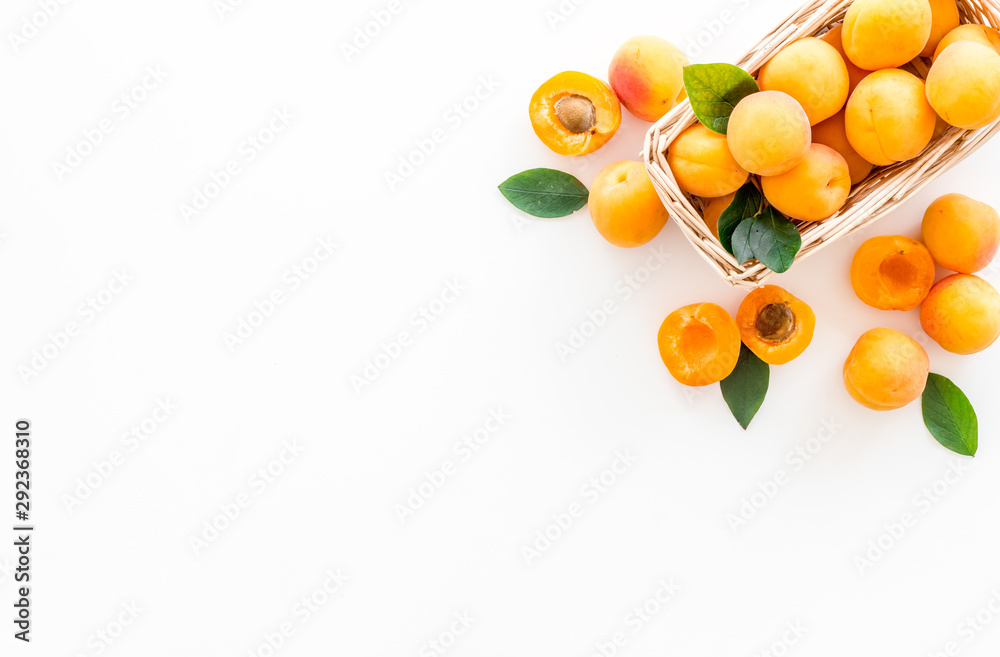 Collect apricots, white background top view copy space, pattern with leaves