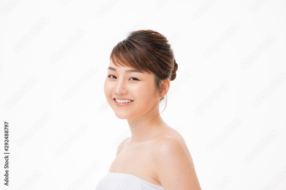 Closeup portrait of attractive asian woman with fair perfect healthy glow skin isolated on white,