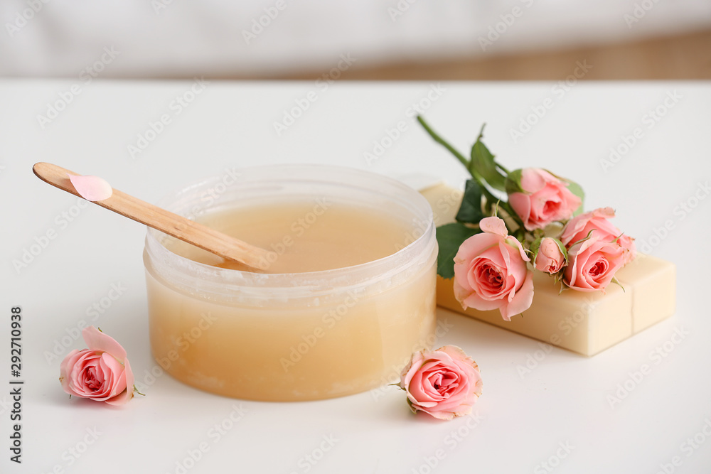 Sugaring paste and flowers on table