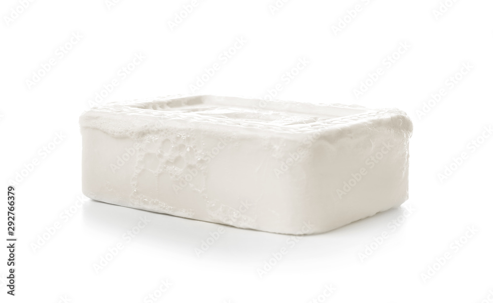 Soap bar with foam on white background