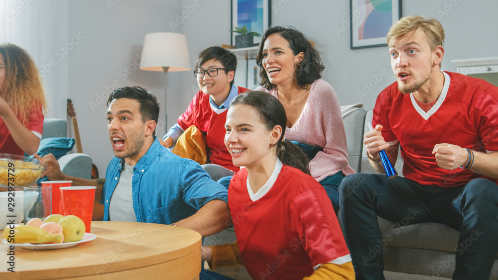 At Home Diverse Group of Sports Fans Wearing Teams Uniform Watch Sports Game Match on TV, They Chee