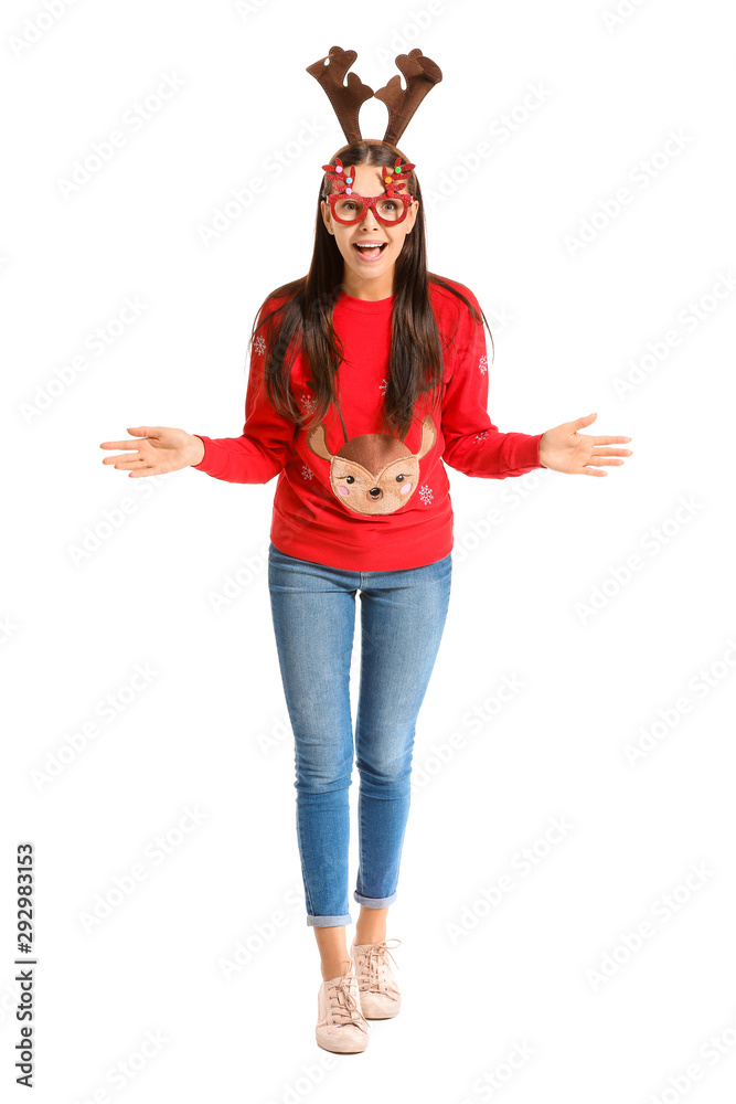 Funny young woman in Christmas sweater on white background