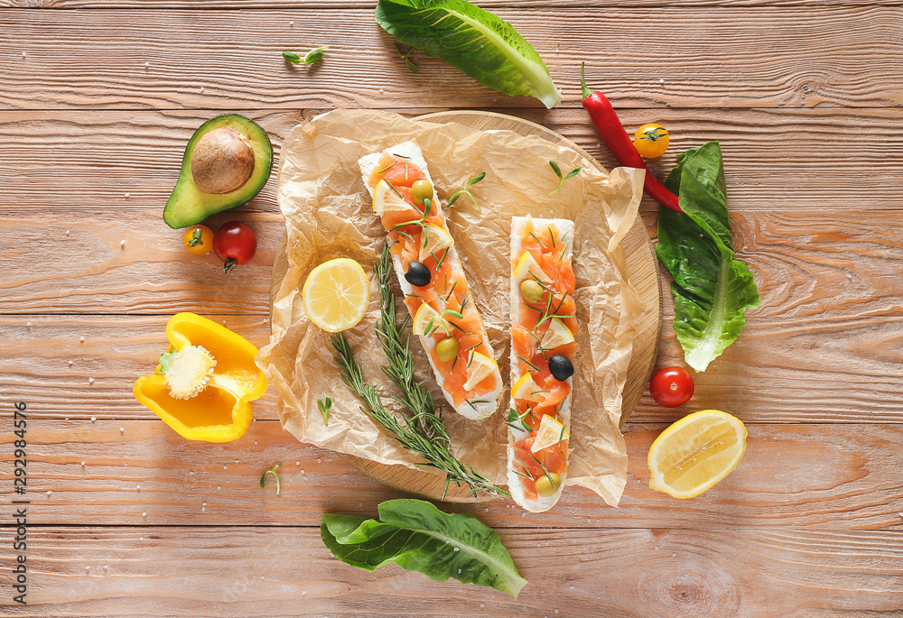 Tasty sandwiches on wooden background