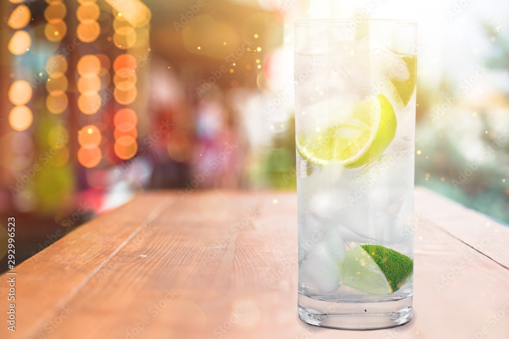 Glass of water  and lime on  background