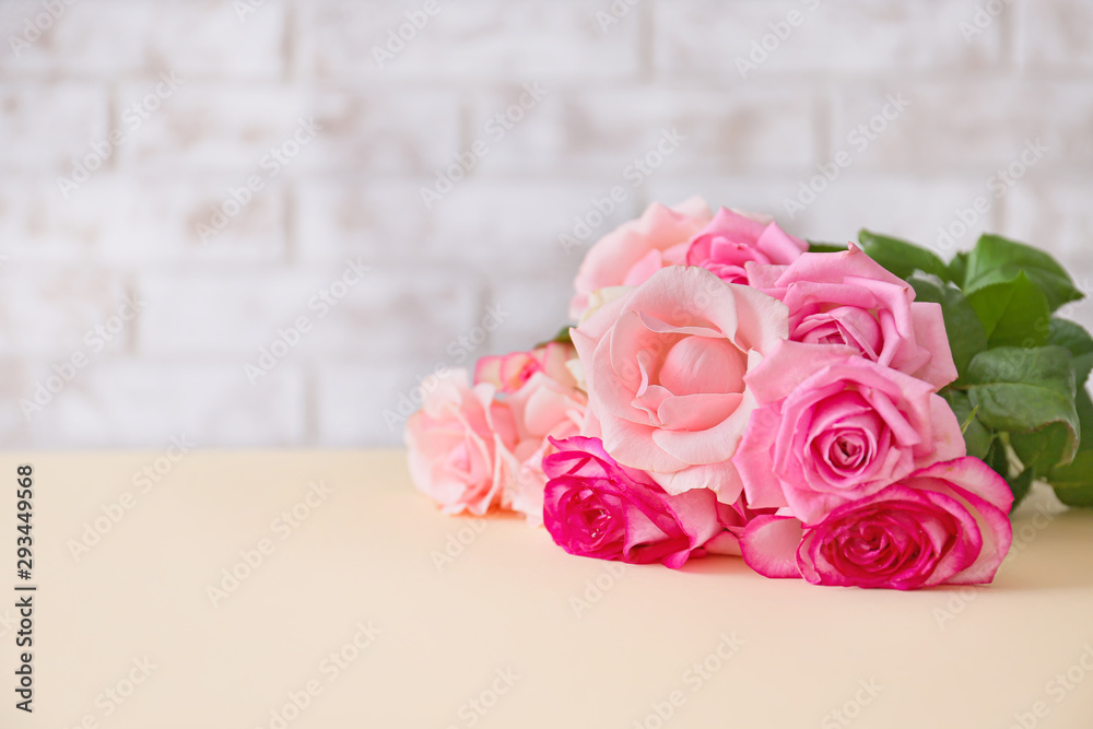 Beautiful rose flowers on table