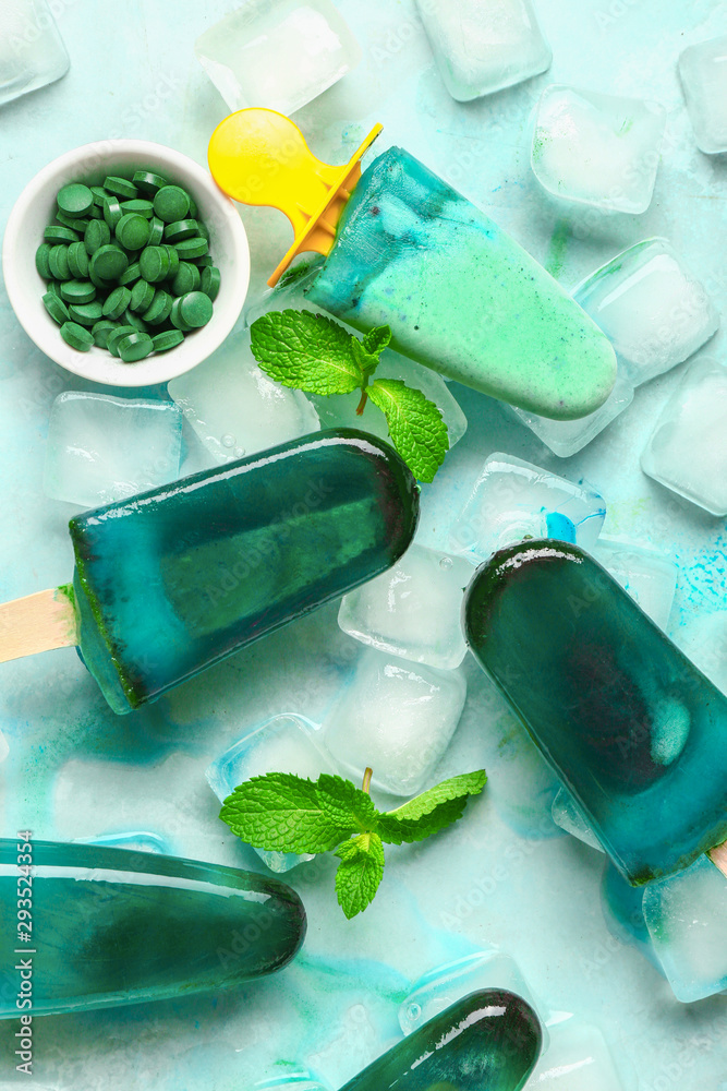 Tasty spirulina ice-cream on light background