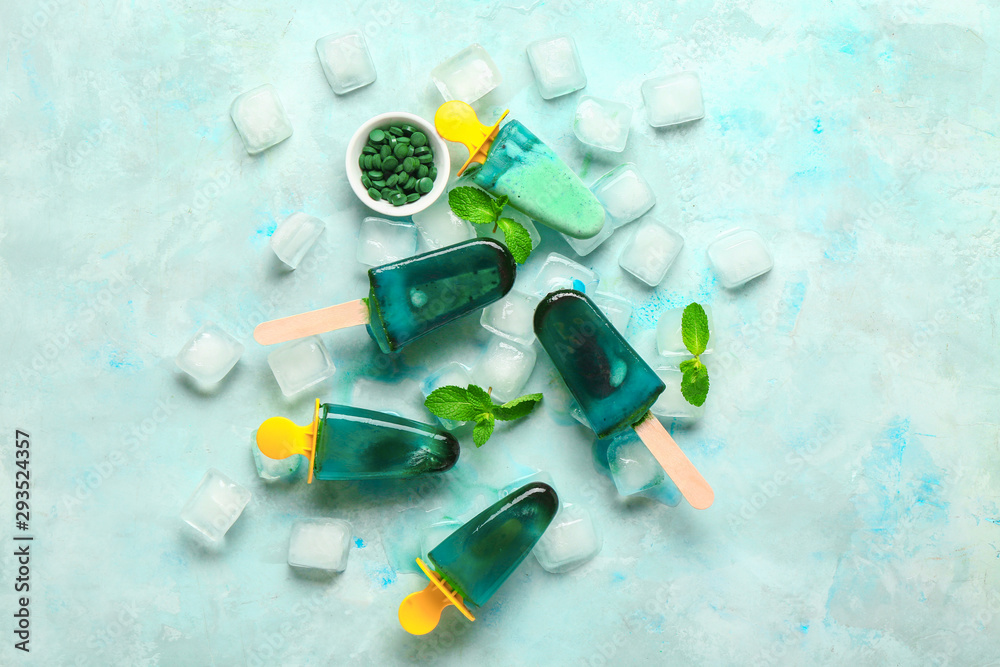 Tasty spirulina ice-cream on light background