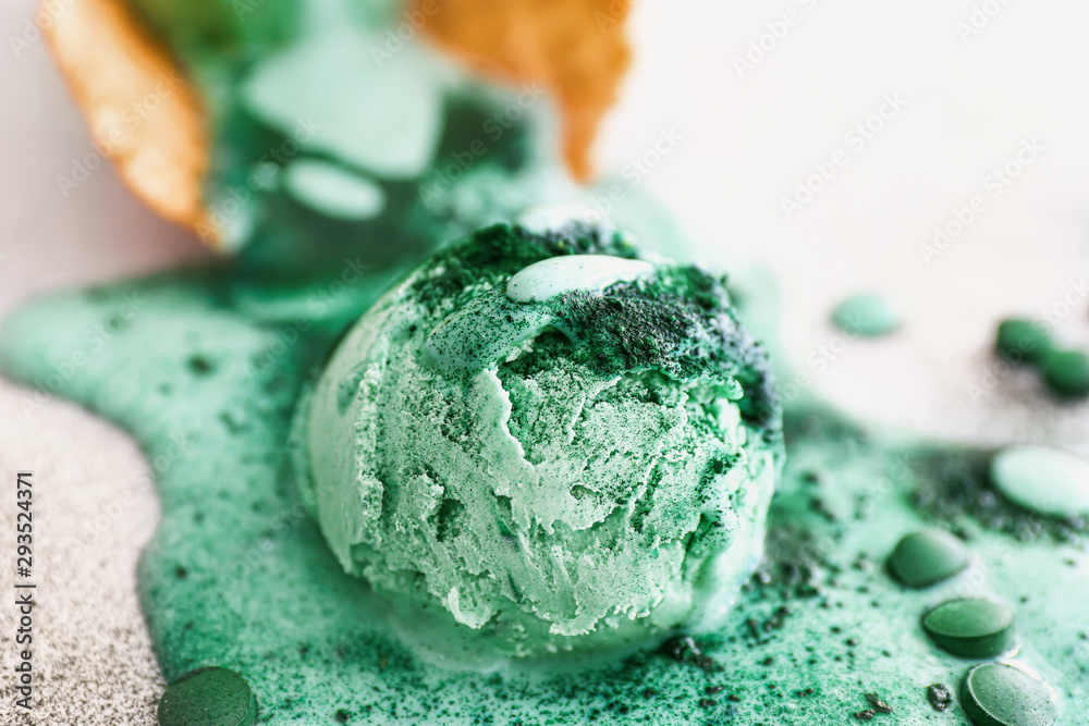 Tasty spirulina ice-cream on table, closeup