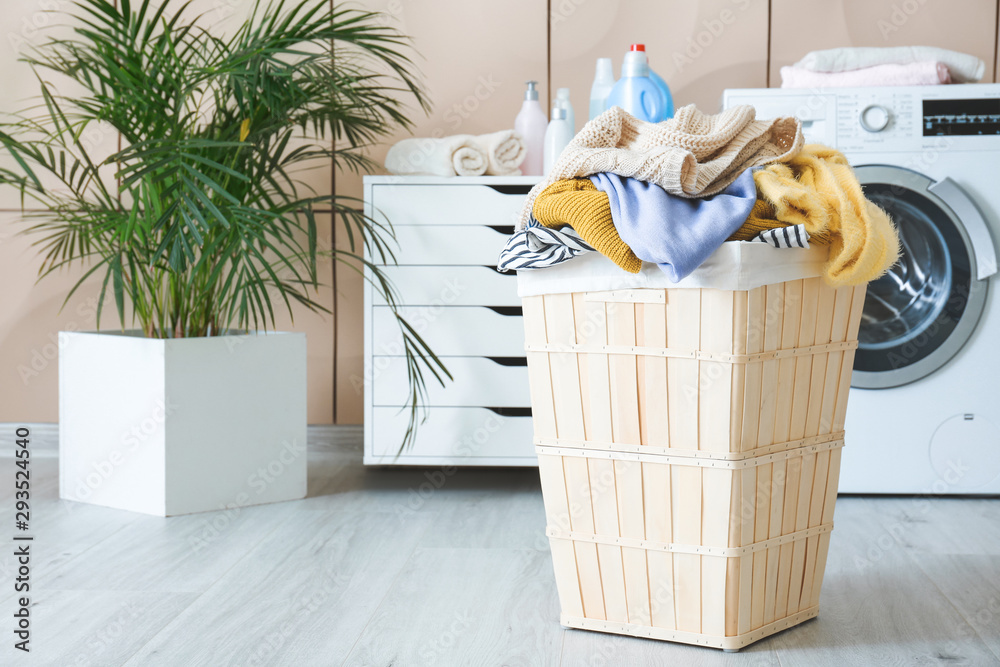 Basket with laundry in bathroom