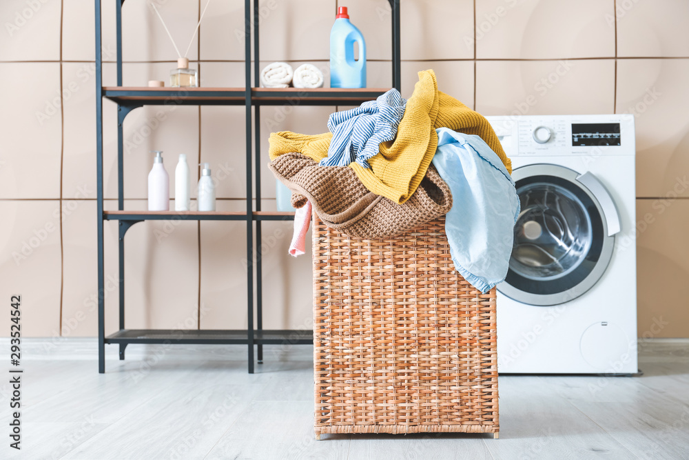 Basket with laundry in bathroom