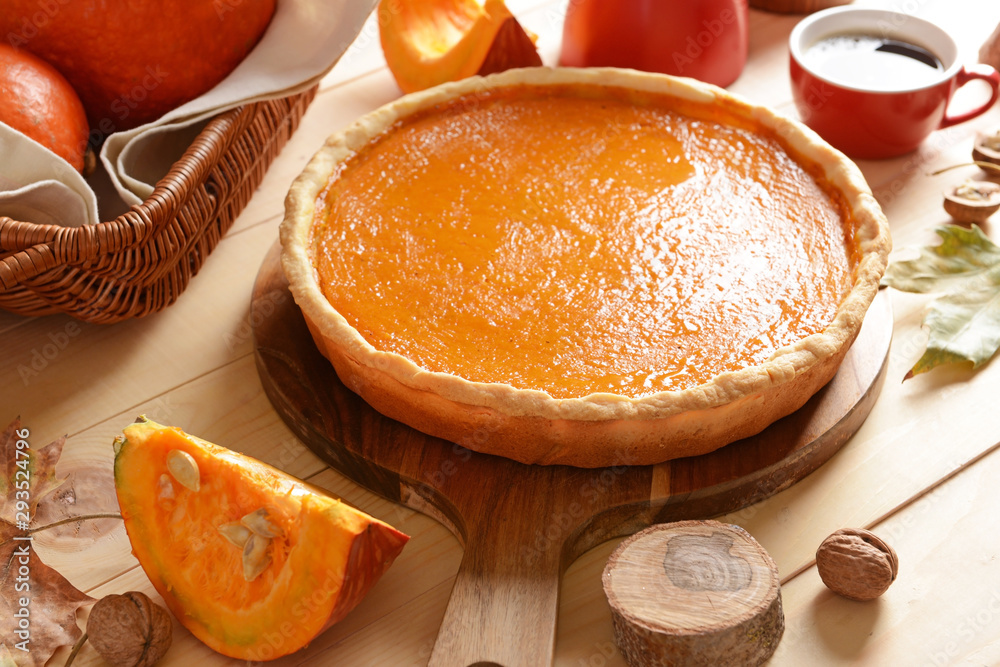 Tasty pumpkin pie on wooden table