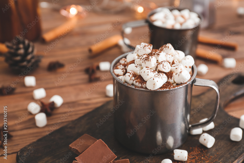 Cup of hot chocolate with marshmallows on table