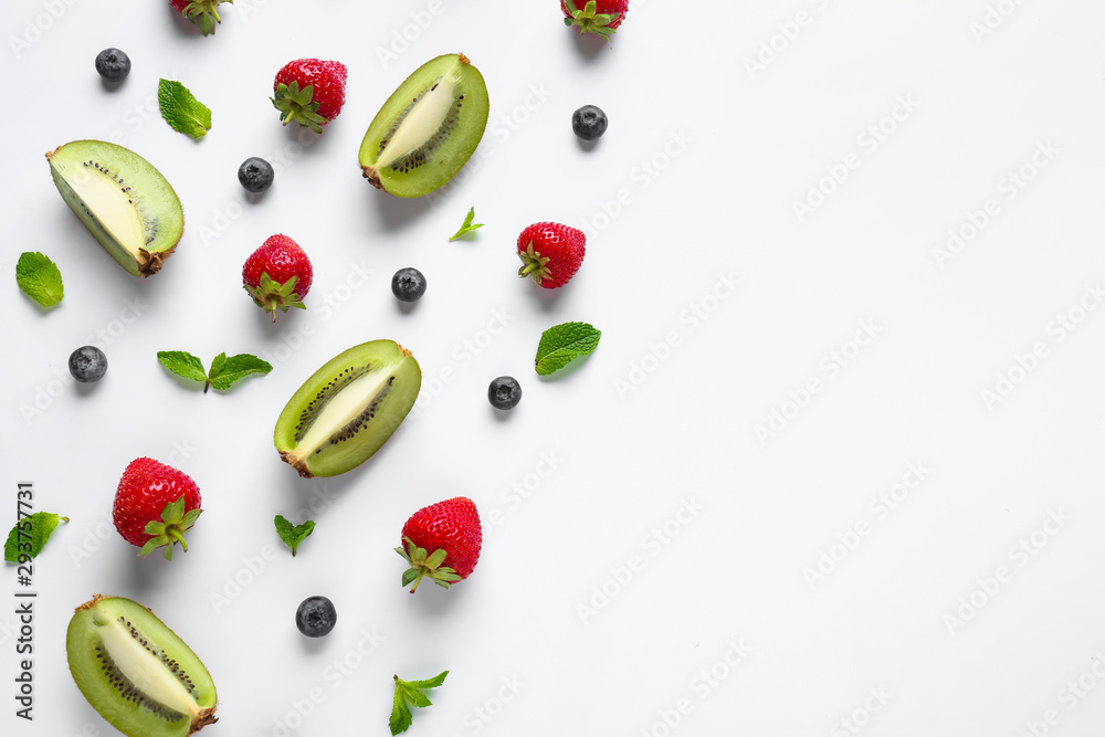 Sweet ripe fruits and berries on white background