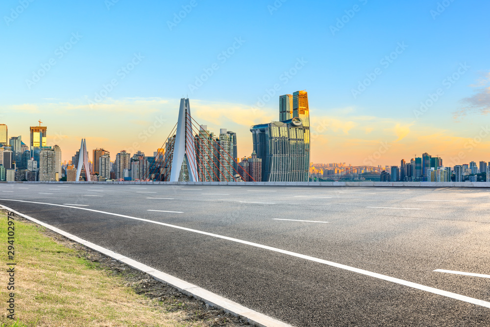 Asphalt highway passes through the city financial district in Chongqing at sunrise,China.