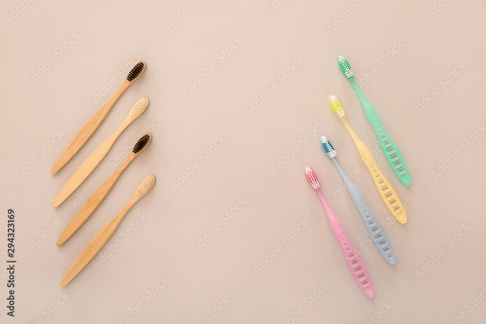 Different tooth brushes on color background