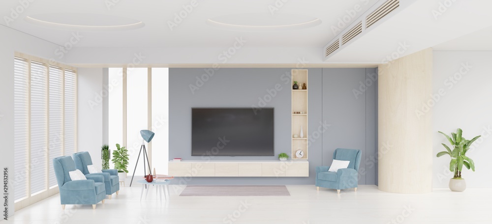 TV cabinet and display and dark blue chair on concrete wall with wooden flooring.