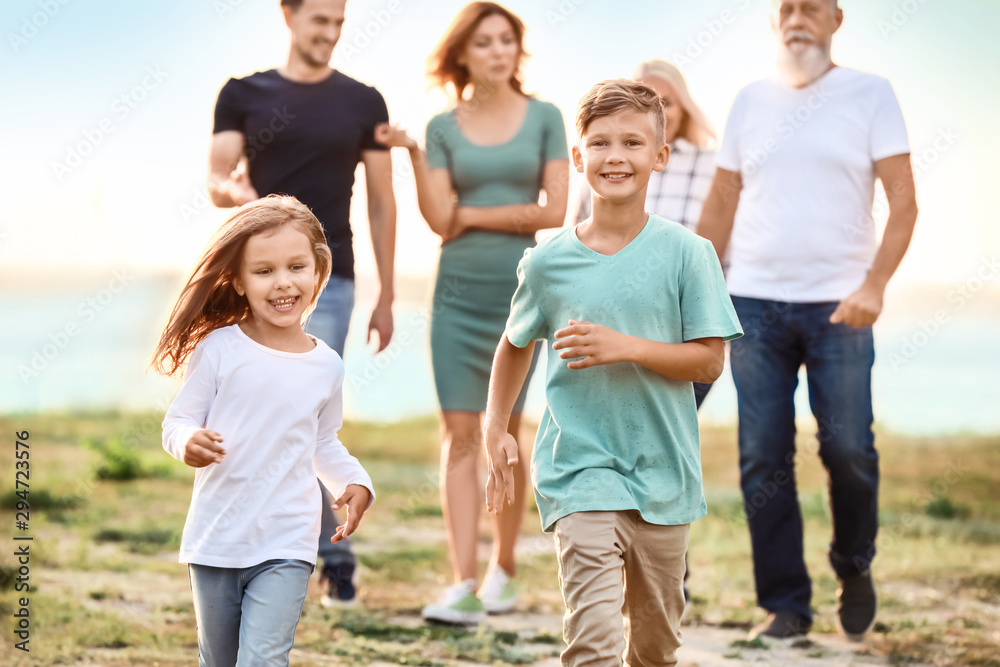 Little children with their family in park